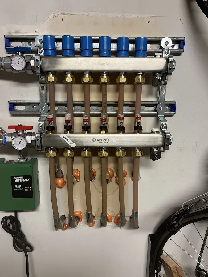 Plumber performing Water Heater Repair at a residential property in Pelham